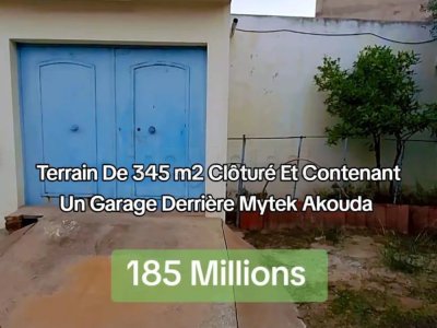 TERRAIN CLOTURÉ CONTENANT UN GARAGE DERRIÉRE MYTEK AKOUDA